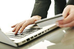 man paying on laptop online 