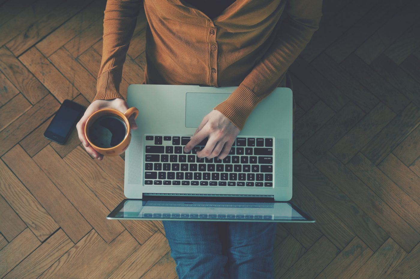 Someone Searching On Laptop With Coffee