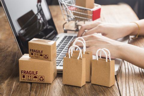 small packages next to laptop