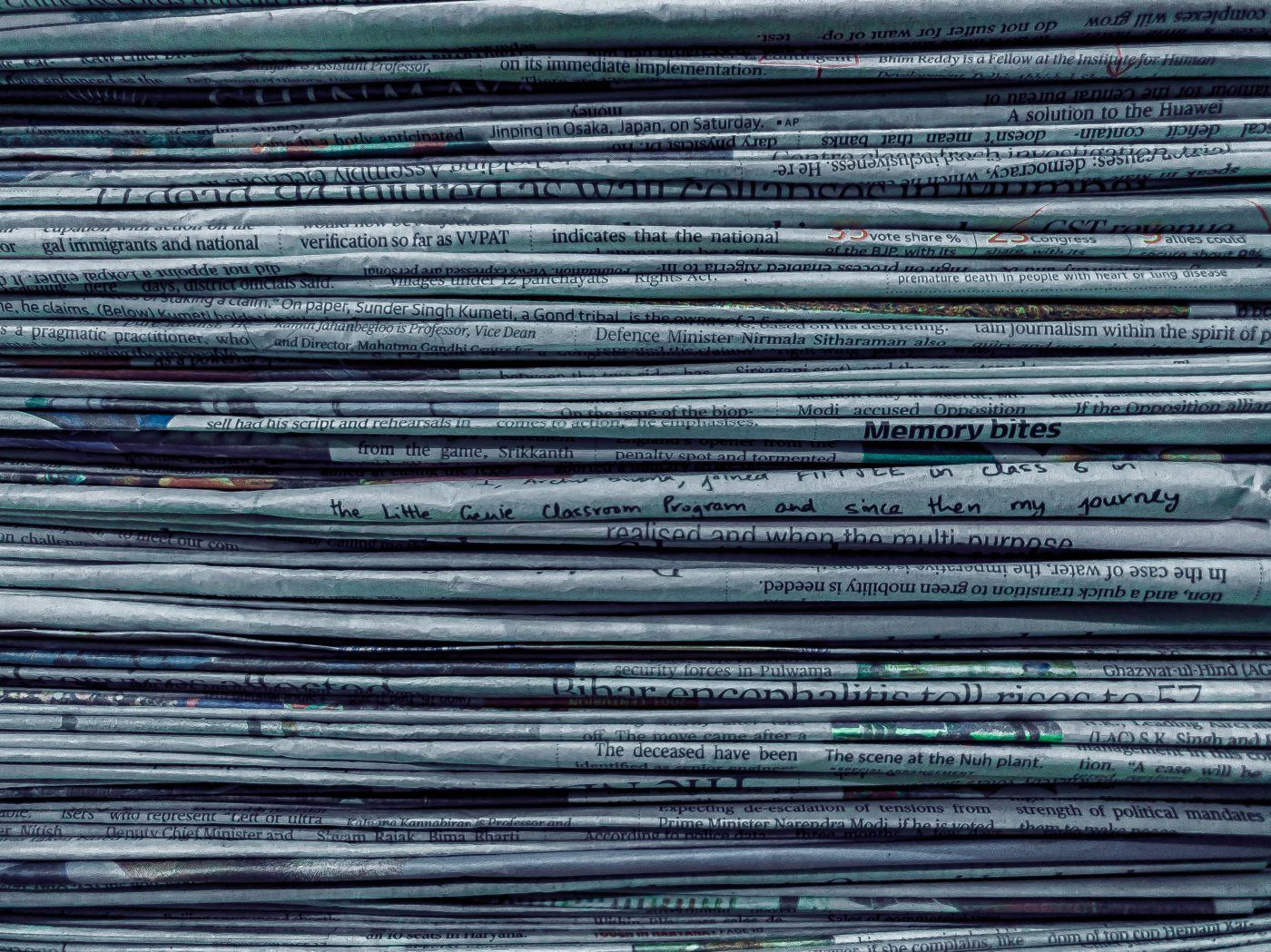 Stacked newspapers