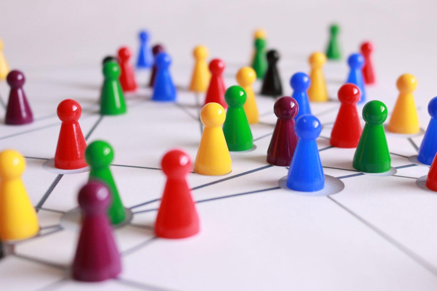 Multi-coloured pins on a board.